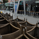 A man walks past chairs stacked up outside restaurants as dining-in is restricted to curb the coronavirus disease (COVID-19) outbreak in Singapore May 17, 2021. REUTERS/Edgar Su